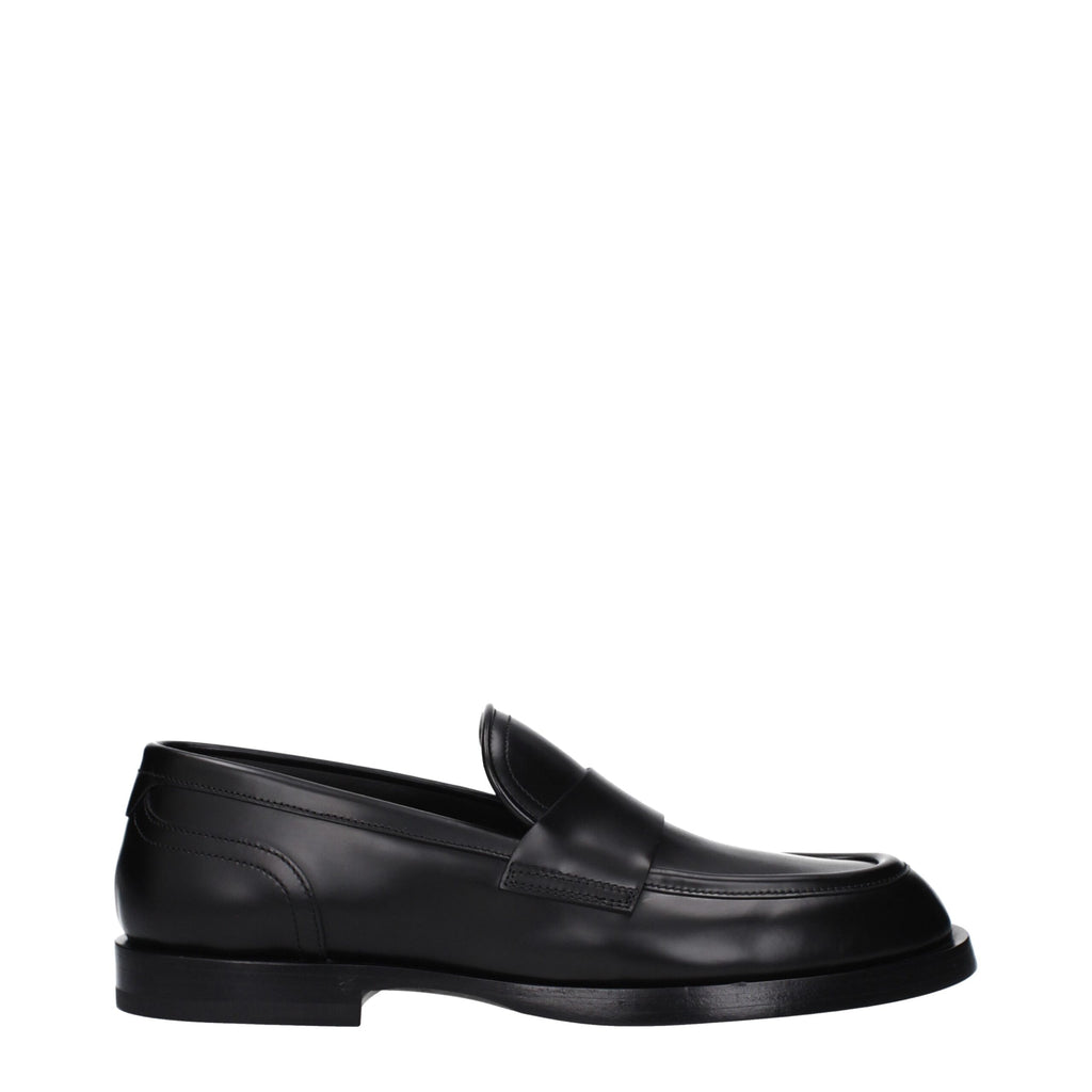 Chaussures mocassins en cuir noir Dolce & Gabbana, slip-on élégants pour homme, visibles avec détails en cuir lisse.