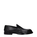 Chaussures mocassins en cuir noir Dolce & Gabbana, slip-on élégants pour homme, visibles avec détails en cuir lisse.
