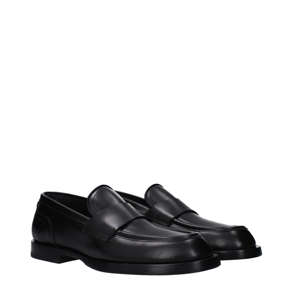 Chaussures mocassins en cuir noir Dolce & Gabbana, slip-on élégants pour homme avec finition soignée.