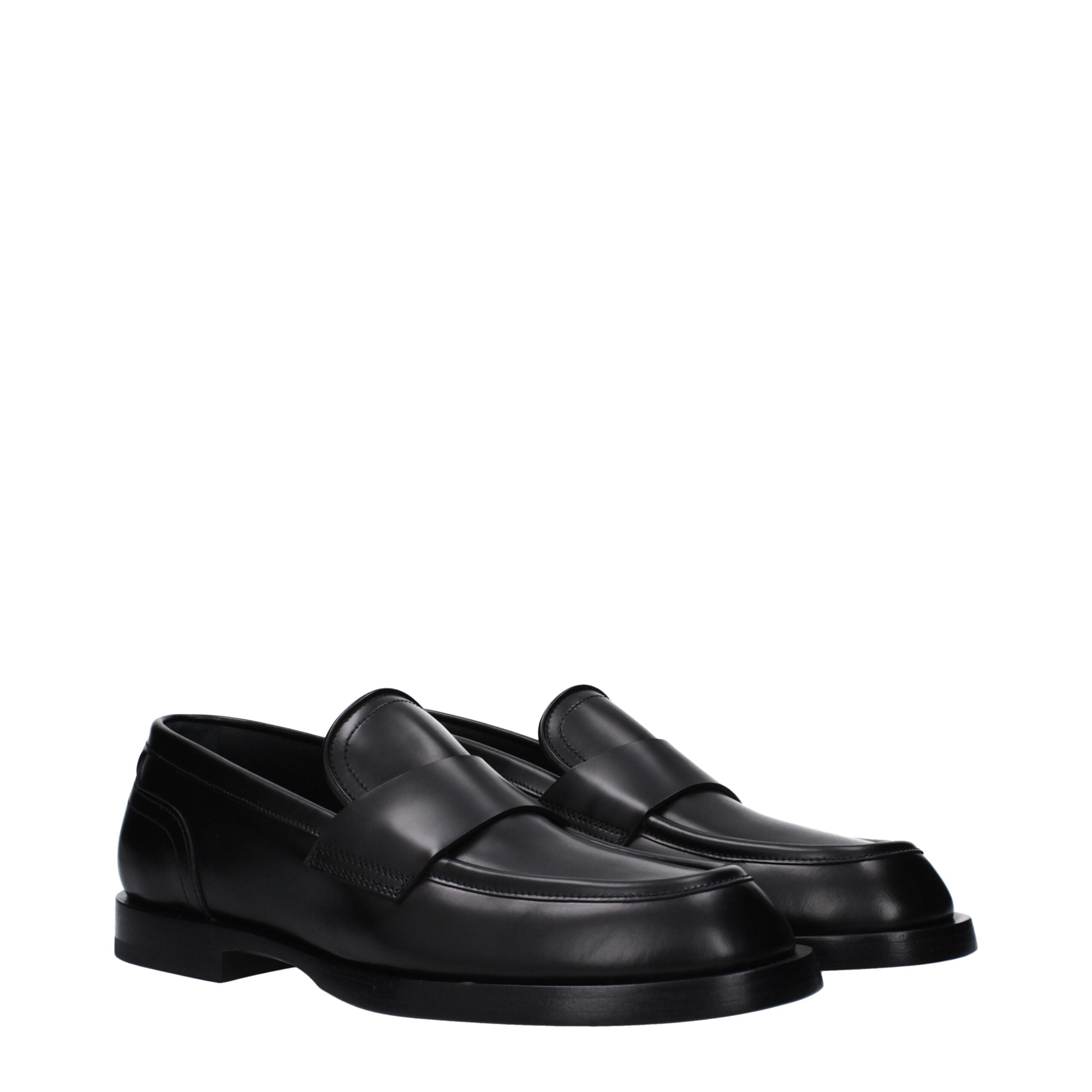 Chaussures mocassins en cuir noir Dolce & Gabbana, slip-on élégants pour homme avec finition soignée.