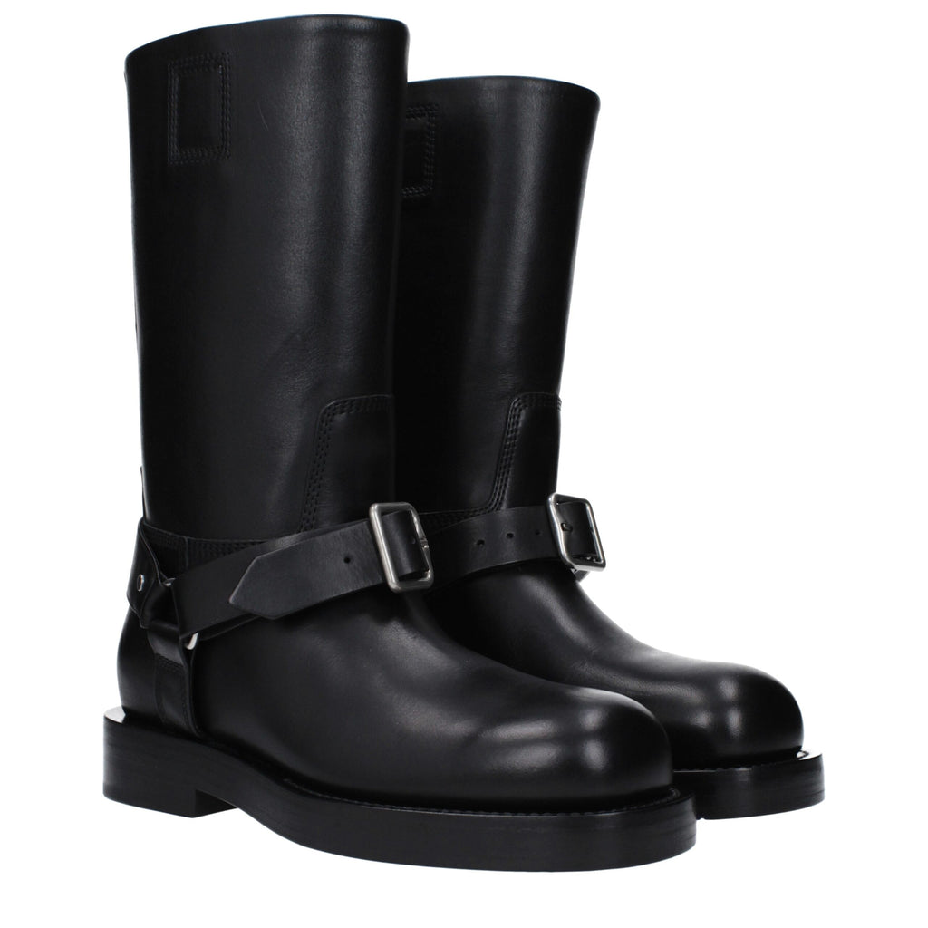 Bottes en cuir noir Burberry pour femme, élégantes et sophistiquées, avec détails en cuir et semelle en caoutchouc.