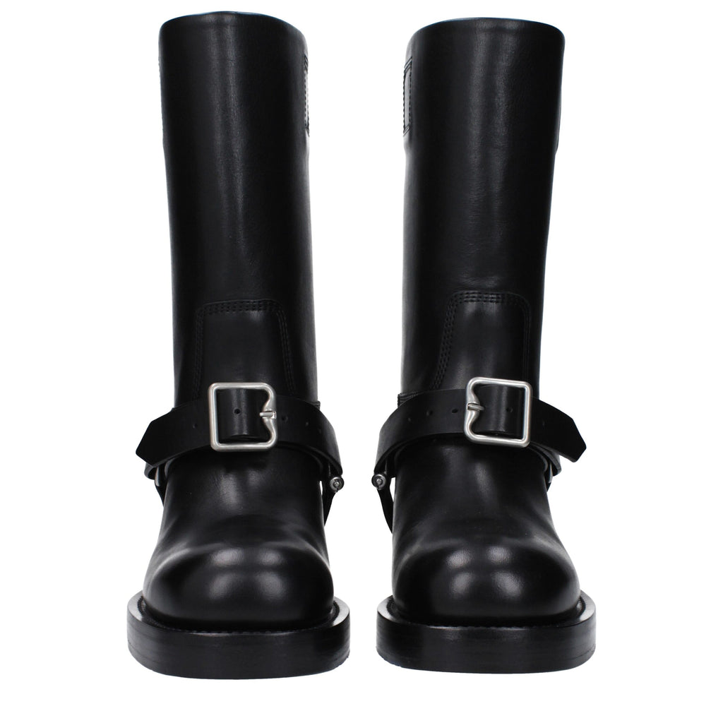 Bottes en cuir noir Burberry pour femme, design élégant avec détails sophistiqués et semelle en caoutchouc.