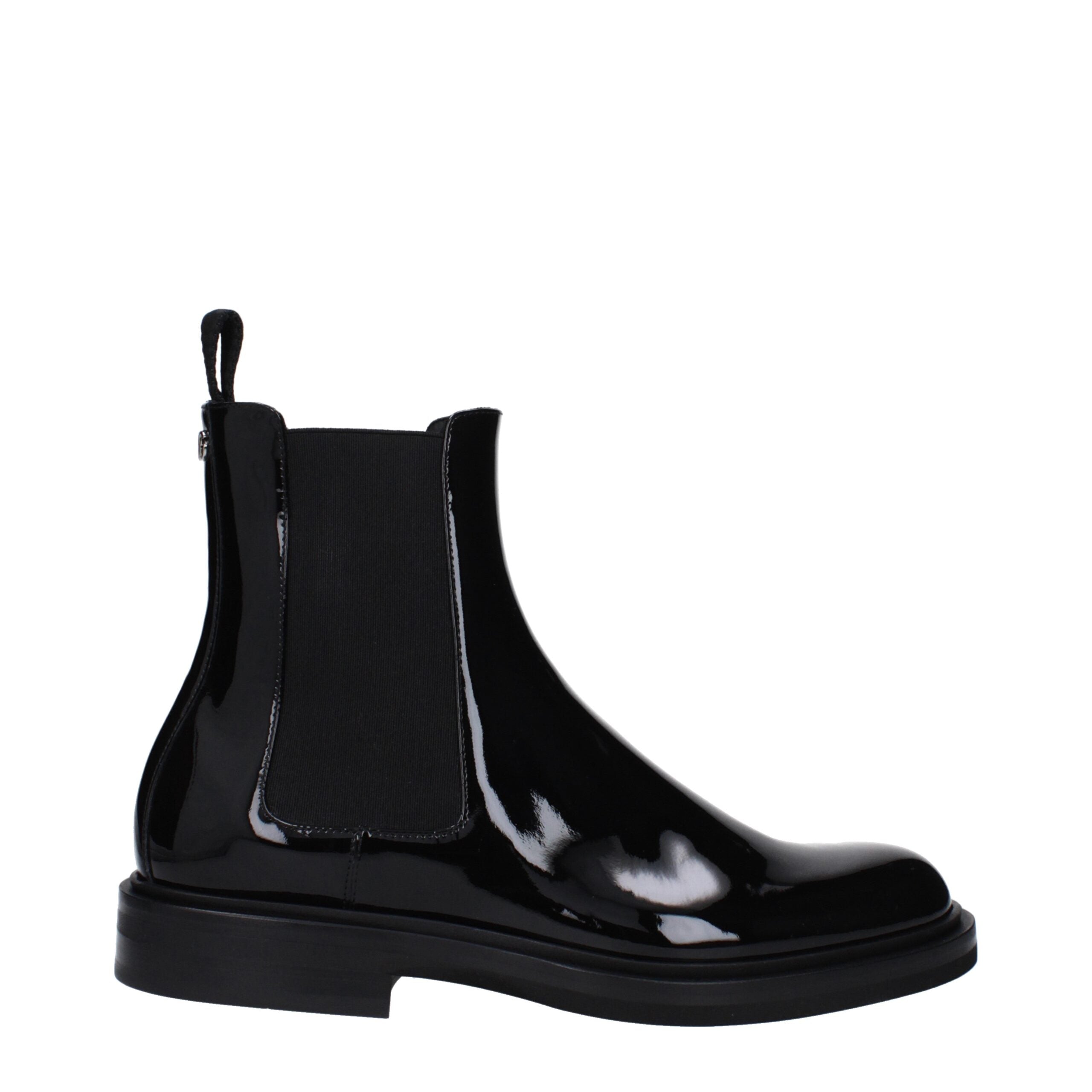 Bottes en cuir noir Dolce & Gabbana pour la cheville, élégantes et sophistiquées, visibles dans l'image.