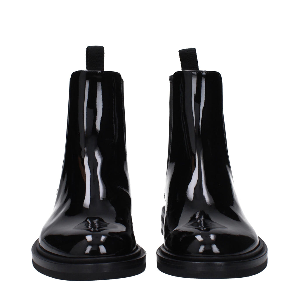 Bottes en cuir noir Dolce & Gabbana pour la cheville, élégantes et modernes, avec détails en cuir et semelle en caoutchouc.