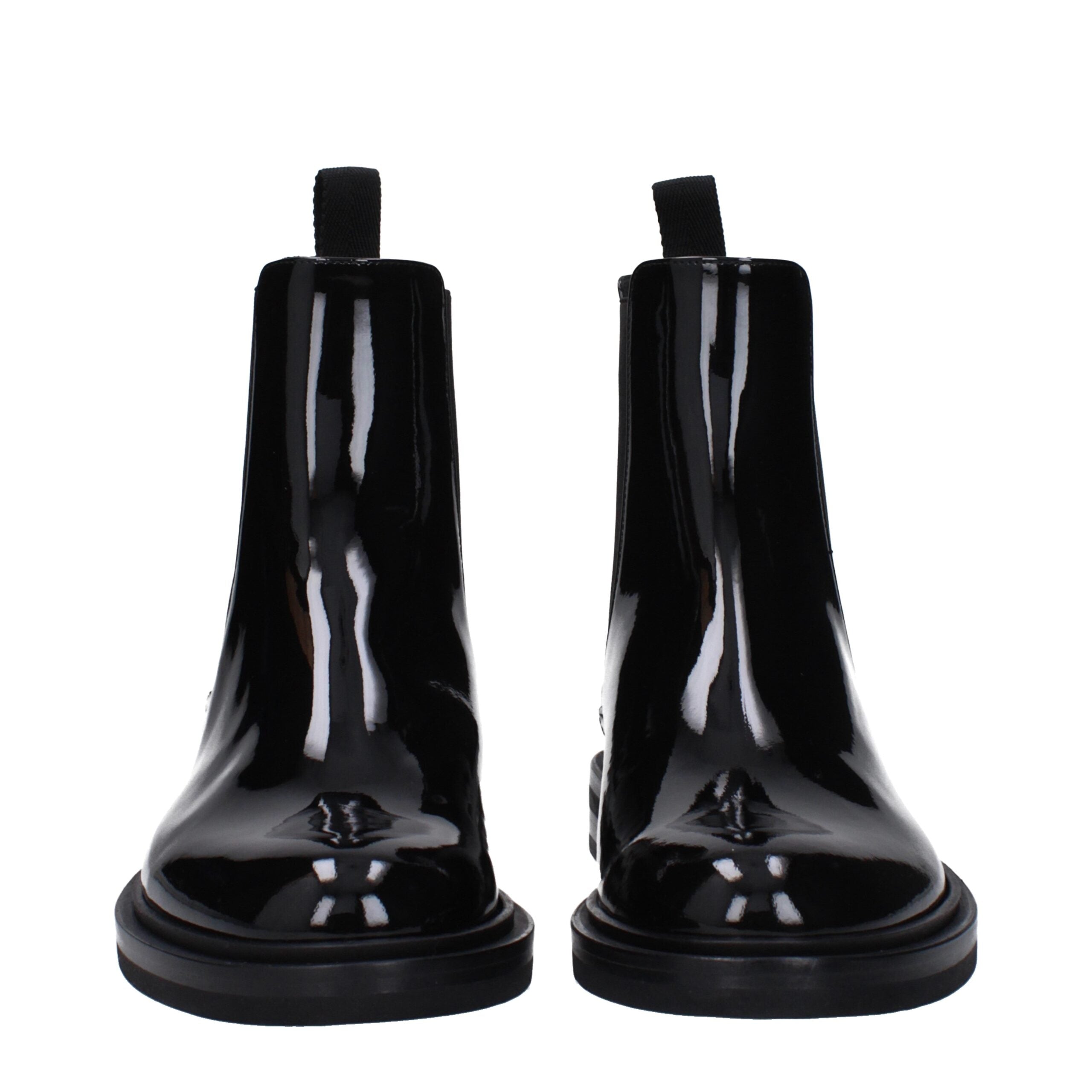 Bottes en cuir noir Dolce & Gabbana pour la cheville, élégantes et modernes, avec détails en cuir et semelle en caoutchouc.