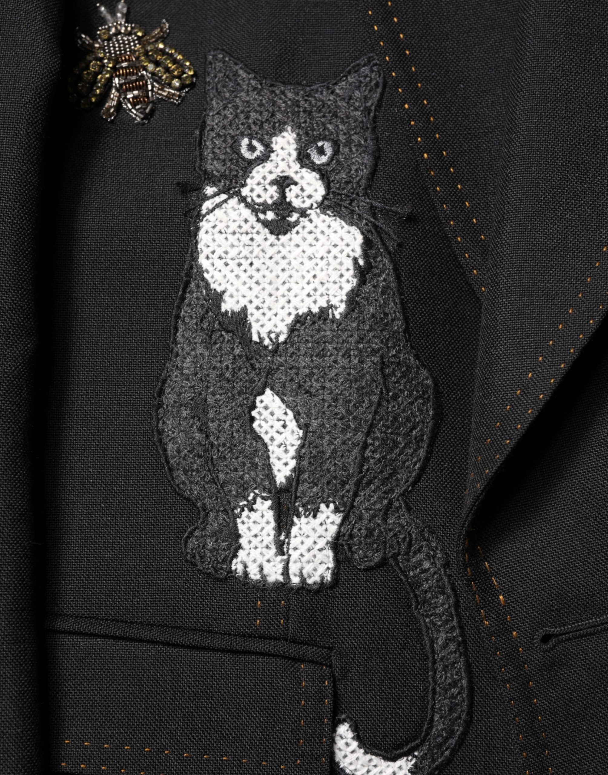 Blazer Dolce & Gabbana noir avec couronne et abeilles brodées, costume élégant pour femme.