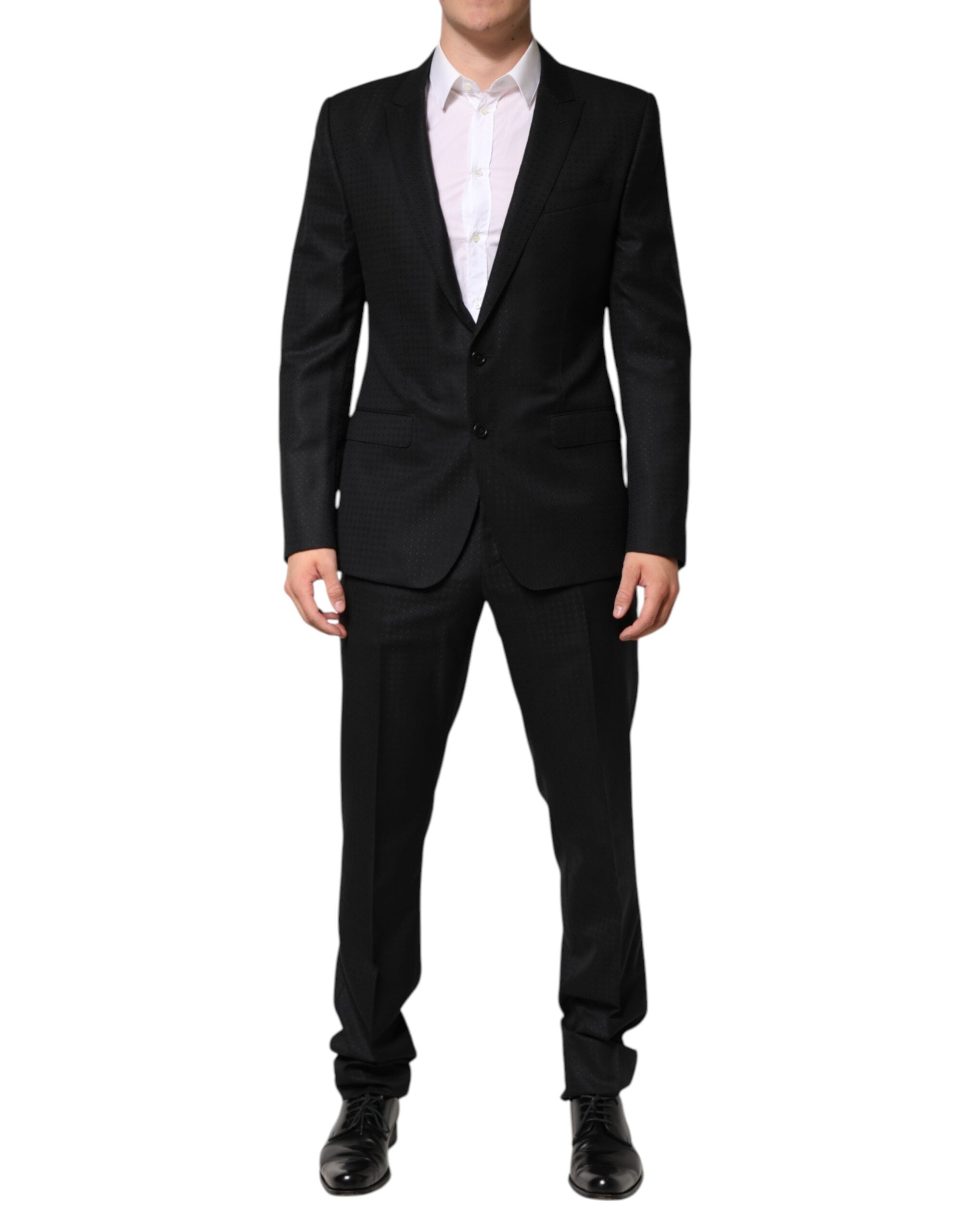 Costume homme Dolce & Gabbana en jacquard noir à deux pièces, veste à simple boutonnage et pantalon élégant.