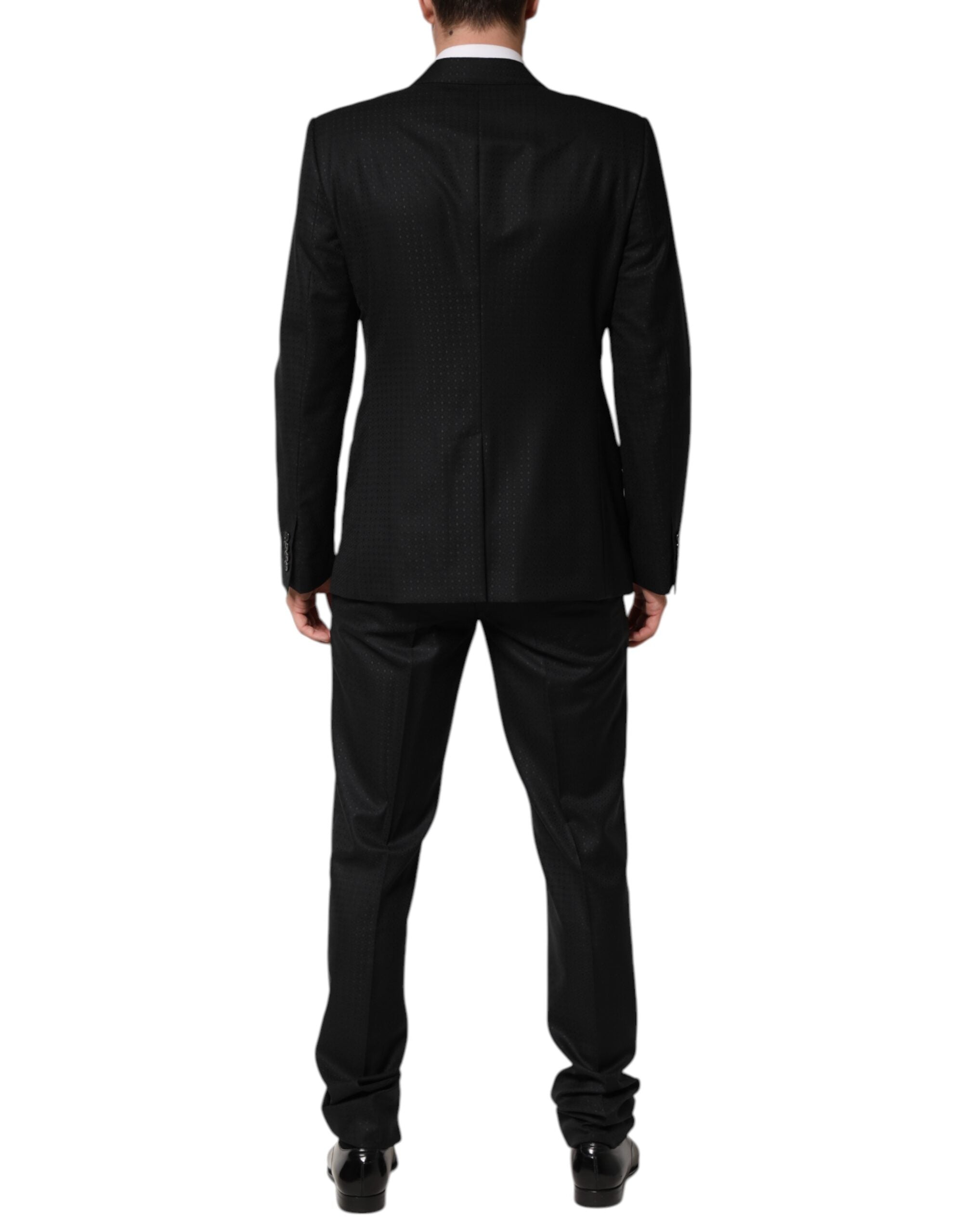 Costume deux pièces en jacquard noir Dolce & Gabbana, veste à simple boutonnage et pantalon assorti.