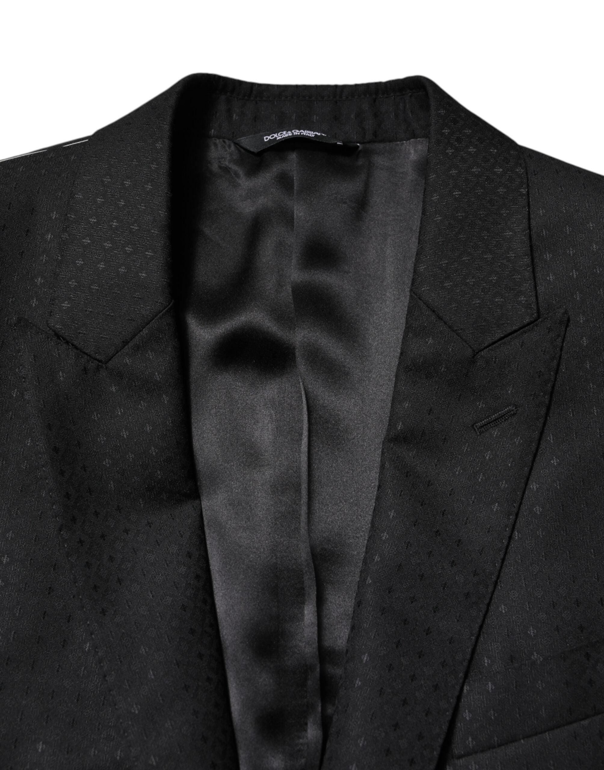Costume deux pièces noir en jacquard Dolce & Gabbana, veste croisée à un bouton et pantalon assorti, élégant et sophistiqué.