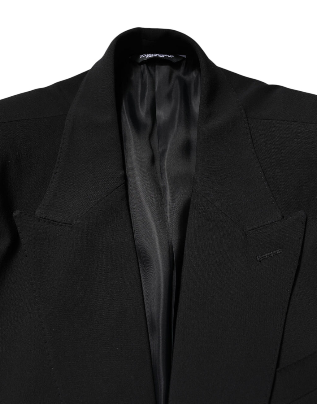 Costume deux pièces noir en coton Dolce & Gabbana, veste à boutonnage simple et pantalon assorti, élégant et moderne.