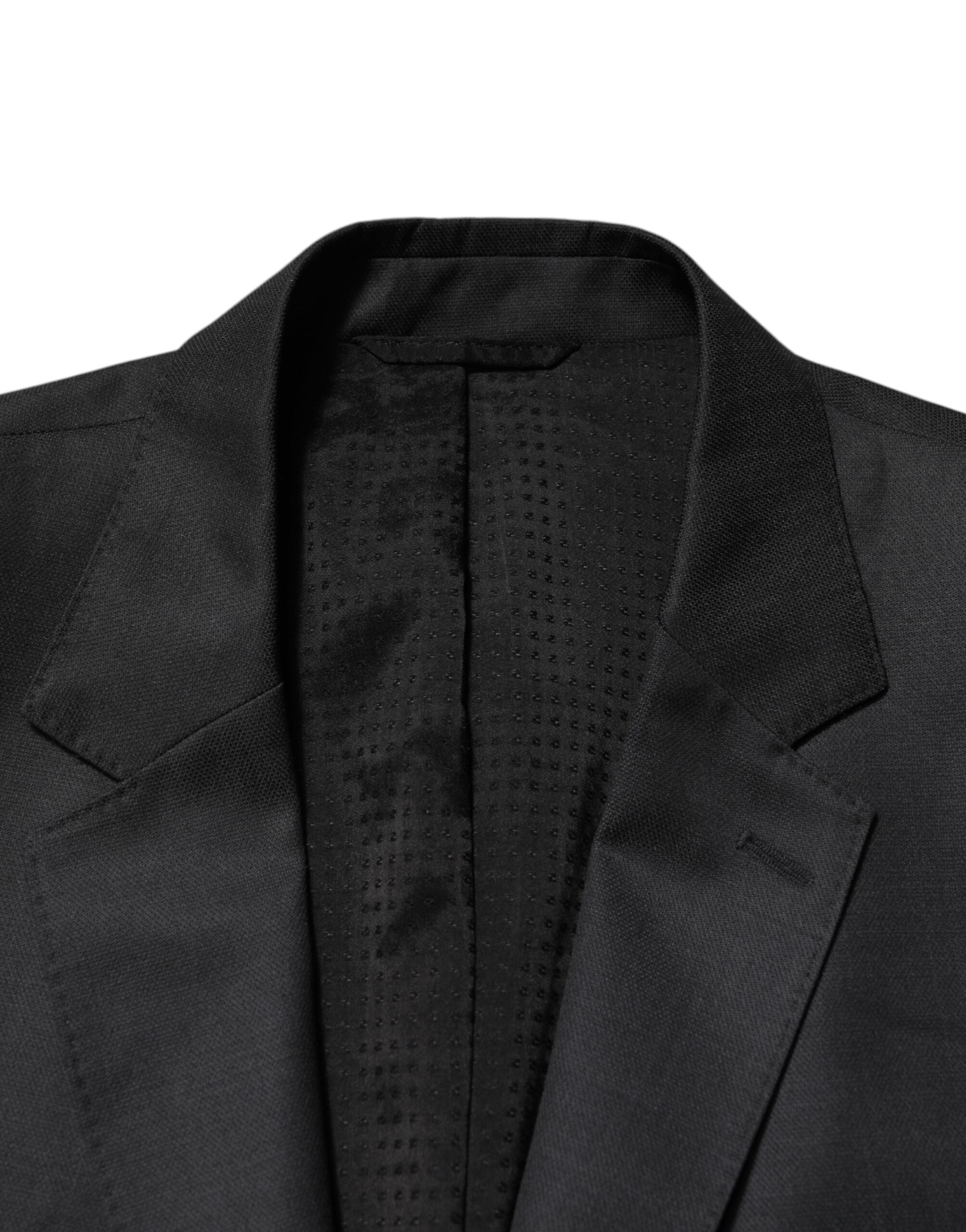 Costume homme en laine gris foncé Dolce & Gabbana, deux pièces, veste croisée simple, adapté pour occasions formelles.