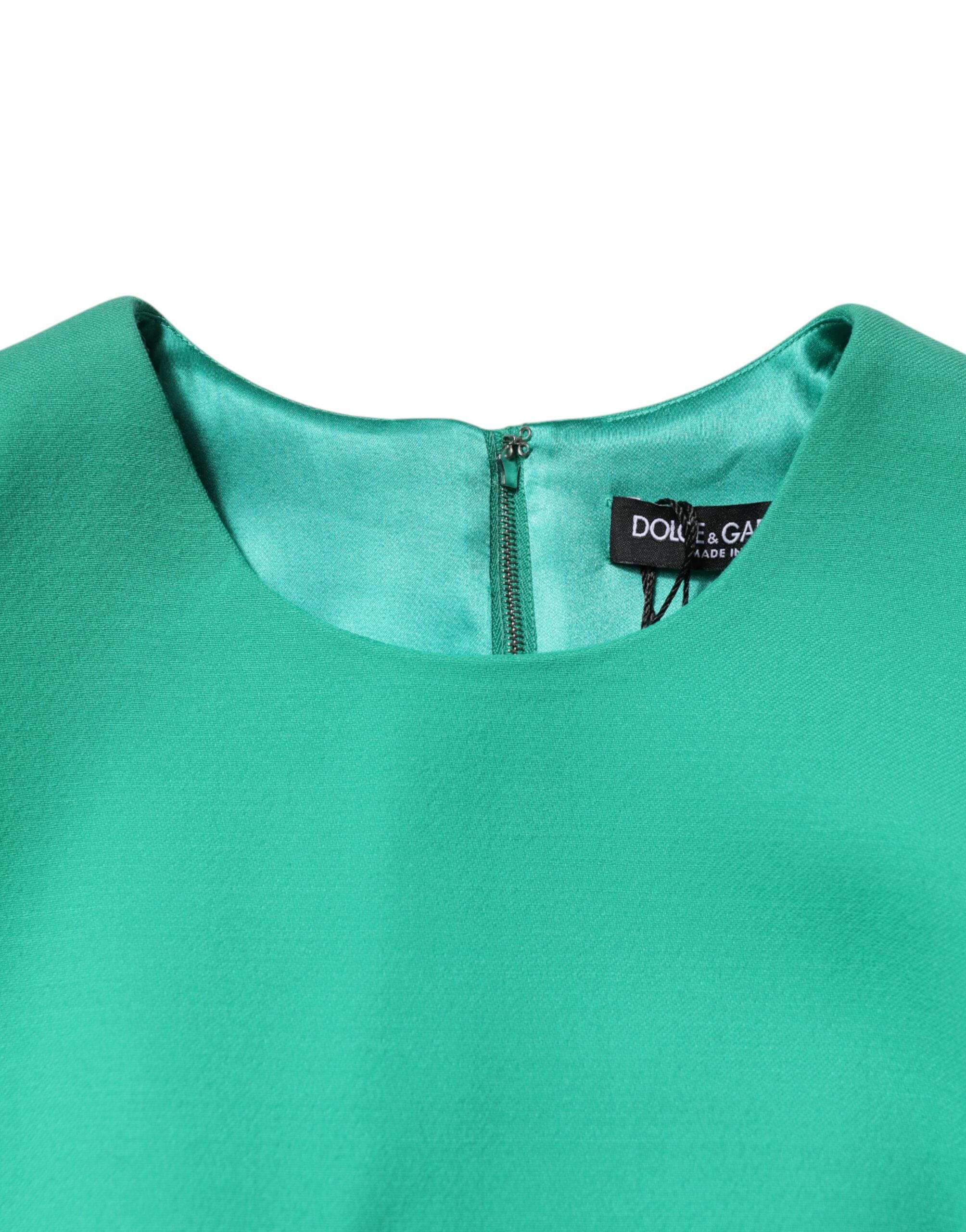 Robe courte moulante sans manches Dolce & Gabbana verte, coupe en A, style bodycon et mini longueur, élégante et moderne.