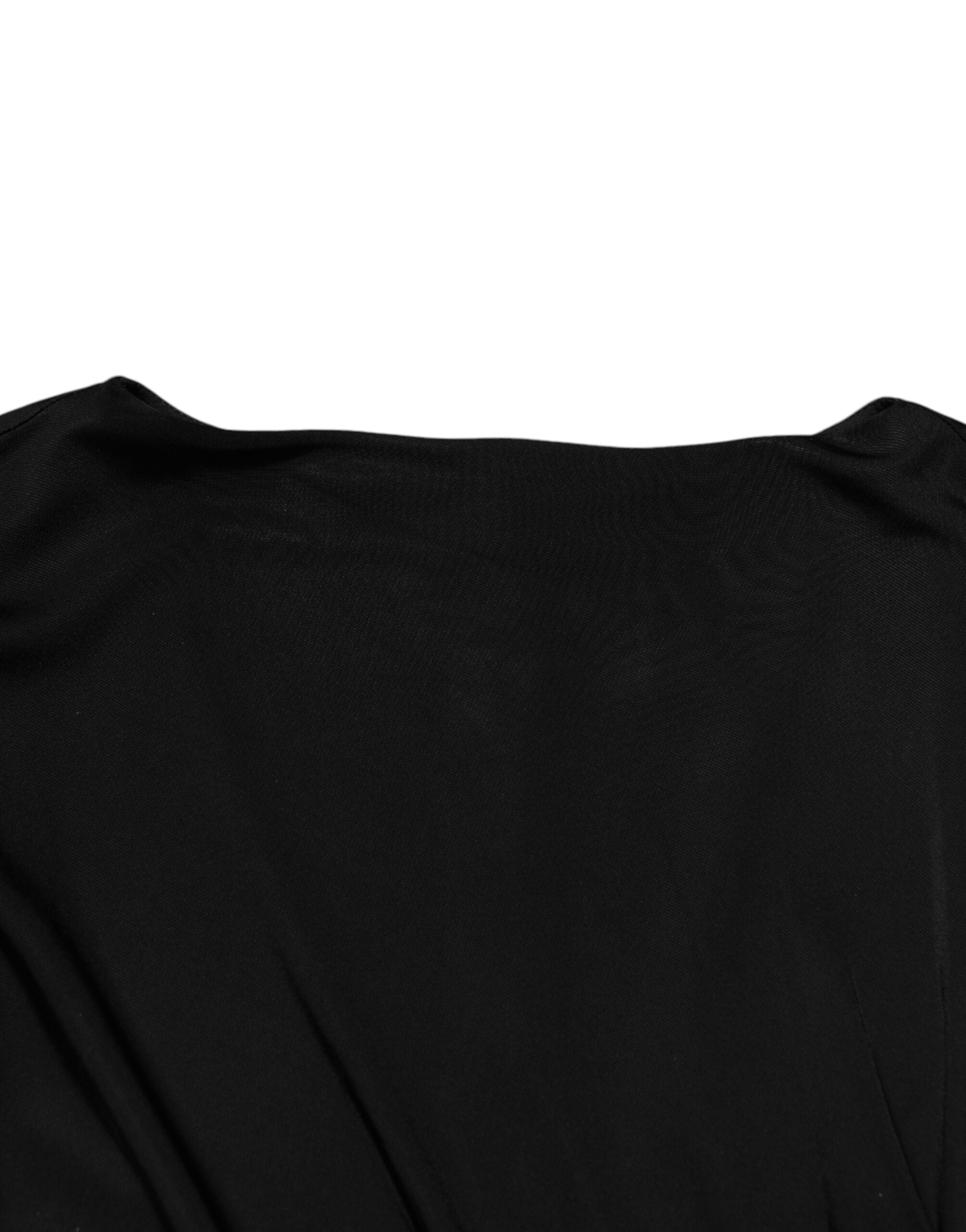 Robe moulante noire à manches courtes de Roberto Cavalli, silhouette élégante et tissu sophistiqué visible sur l'image.