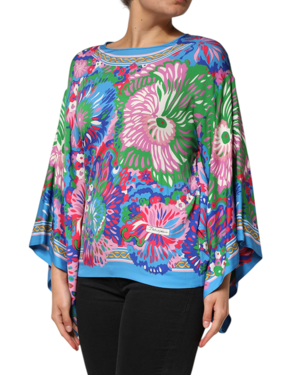 Tunique-blouse Dolce & Gabbana à imprimé floral multicolore, en tissu léger, avec un style élégant et coloré.
