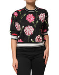 Haut en coton à manches courtes Dolce & Gabbana avec imprimé floral noir, visible avec détails du tissu et du motif floral.