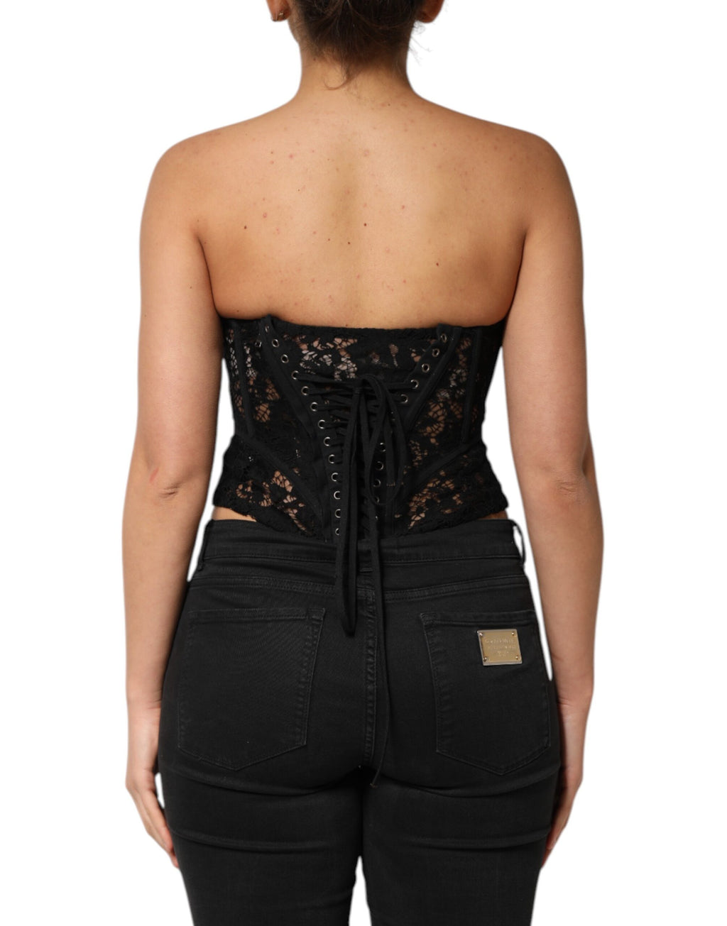 Bustier court noir en dentelle florale sans bretelles de Dolce & Gabbana, haut cropped élégant avec détails floraux.