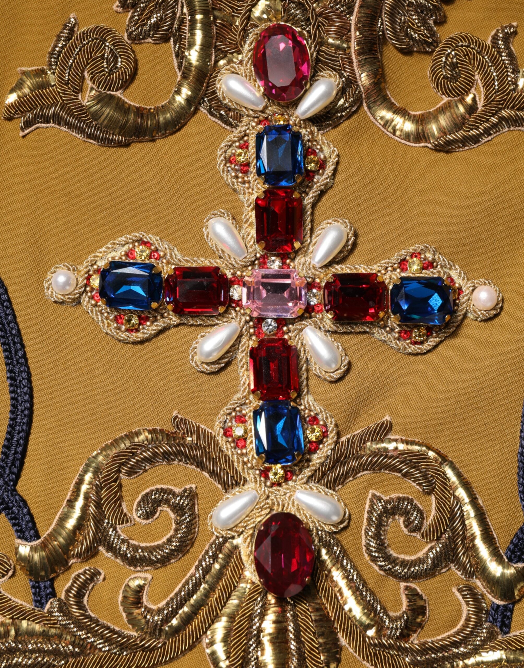 Veste sans manches Dolce & Gabbana jaune avec croix en cristal, style runway, vue de face.