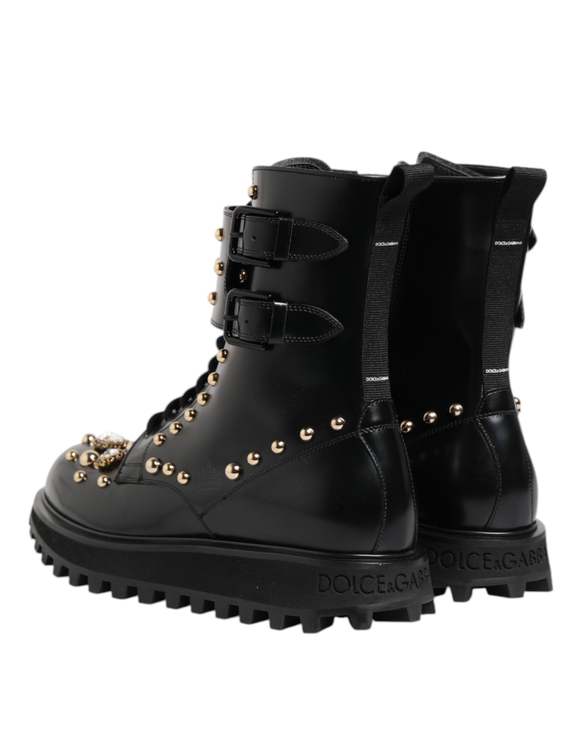 Bottes noires à clous Dolce & Gabbana, mi-mollet, lacets, style élégant et tendance, en cuir avec détails ornementaux.