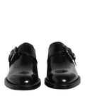 Chaussures de ville en cuir noir Dolce & Gabbana, derby monk strap pour homme, finition élégante et sophistiquée.
