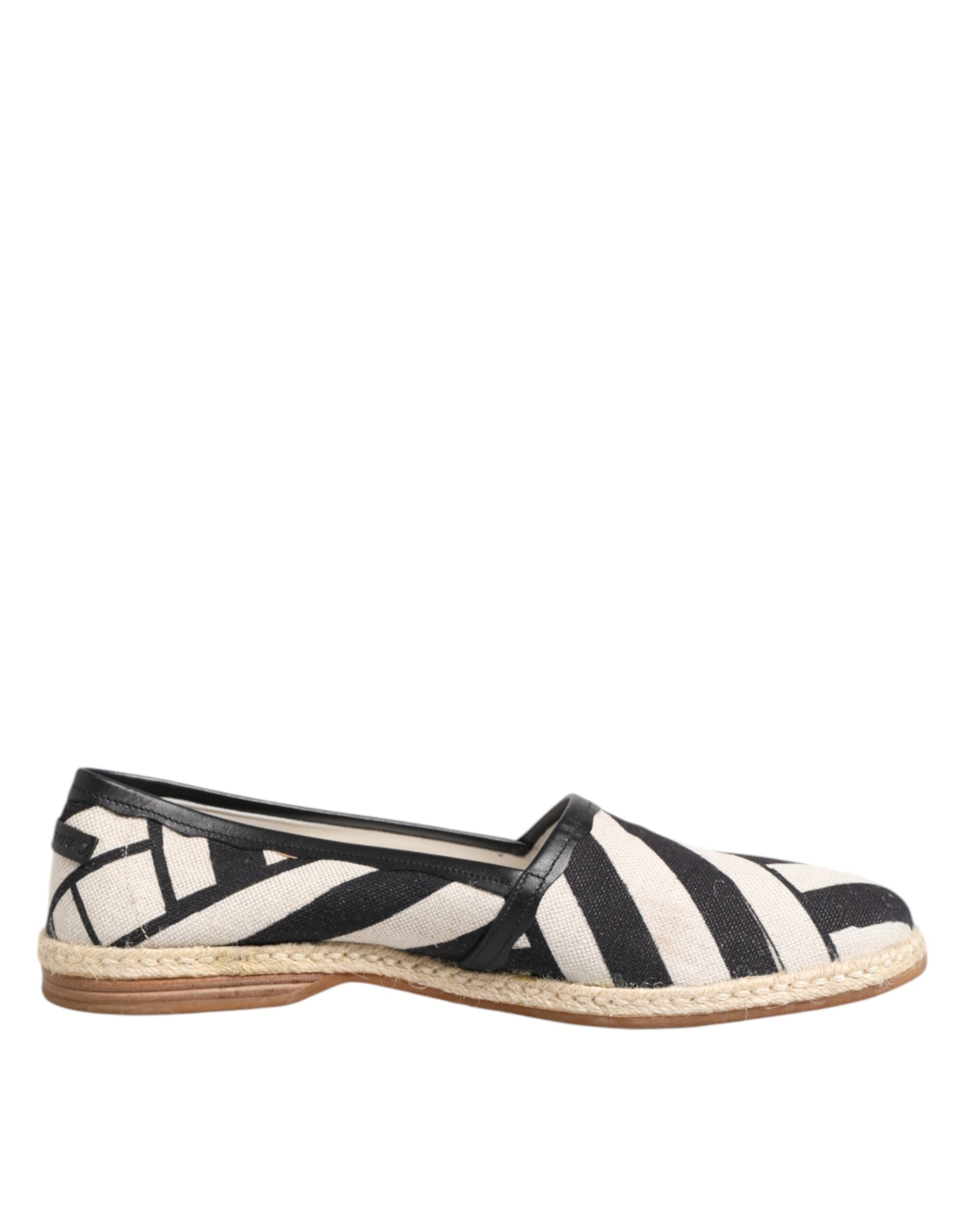 Chaussures espadrilles plates Dolce & Gabbana à rayures noires et blanches, idéale pour un style élégant et décontracté.