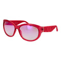 Lunettes de soleil Guess en acier inoxydable rose, avec monture élégante et branches fines, soleil brillant en arrière-plan.