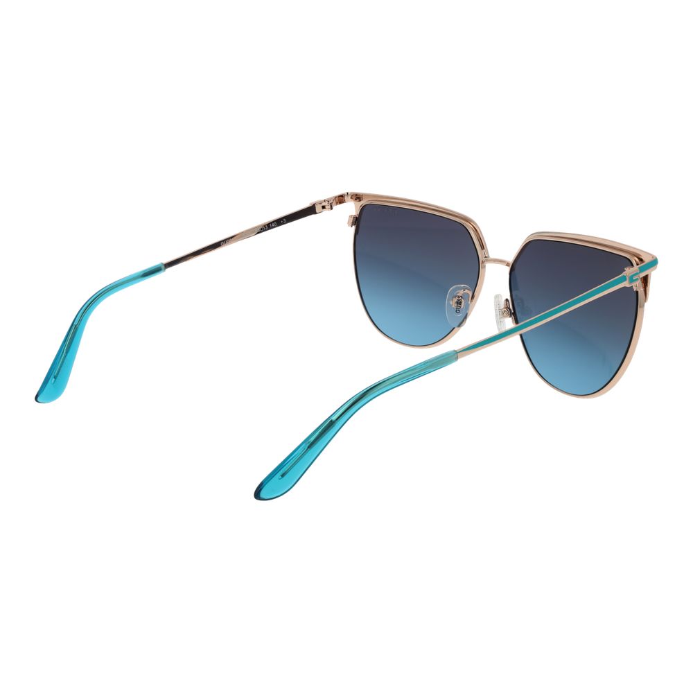 Lunettes de soleil en métal doré Guess, design élégant avec monture fine et branches stylisées, pour un look sophistiqué.