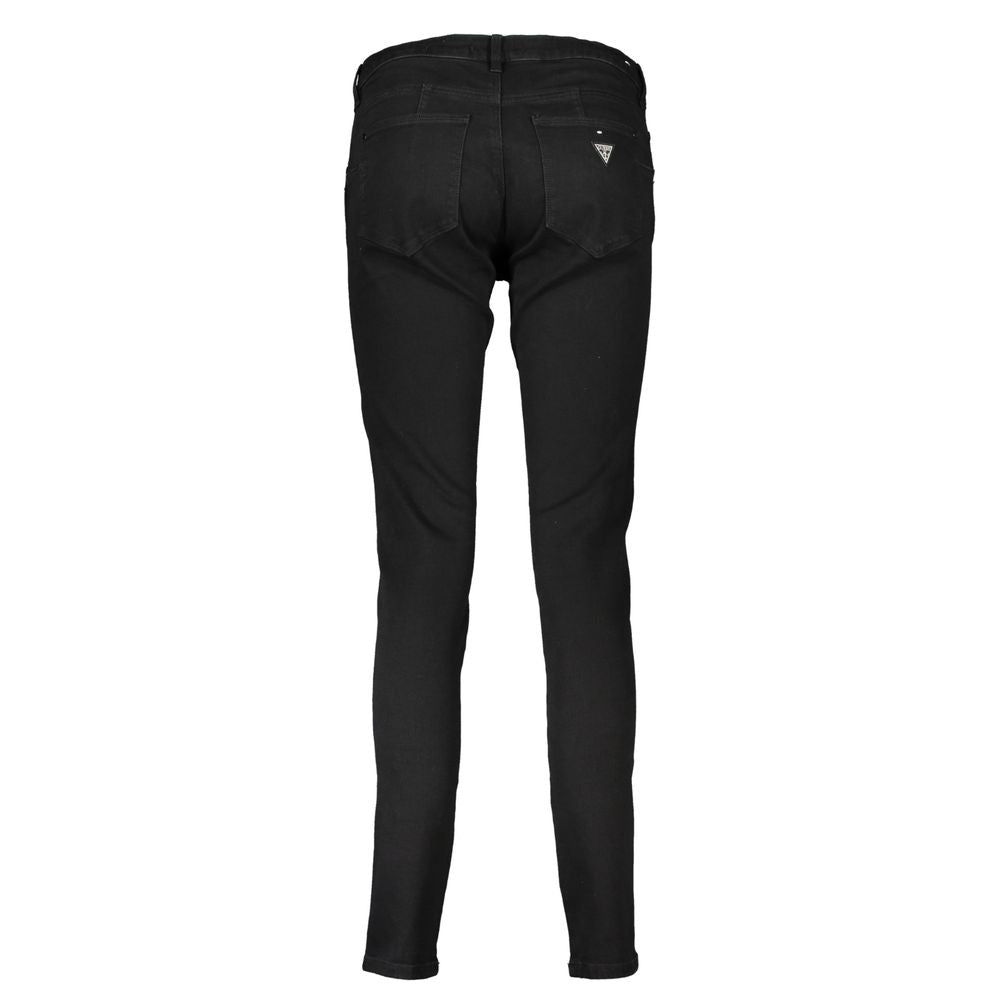 Pantalon skinny noir en coton pour femme de la marque Guess Jeans, vue de face sur un fond blanc.
