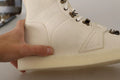 Bottes pour hommes en cuir blanc Dolce & Gabbana avec lacets, style élégant et moderne.