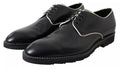 Chaussures formelles en cuir noir et blanc de Dolce & Gabbana, élégantes et sophistiquées pour homme.