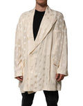 Veste beige en polyester Dolce & Gabbana avec logo monogramme, longue coupe, détails élégants, mode chic et sophistiquée.