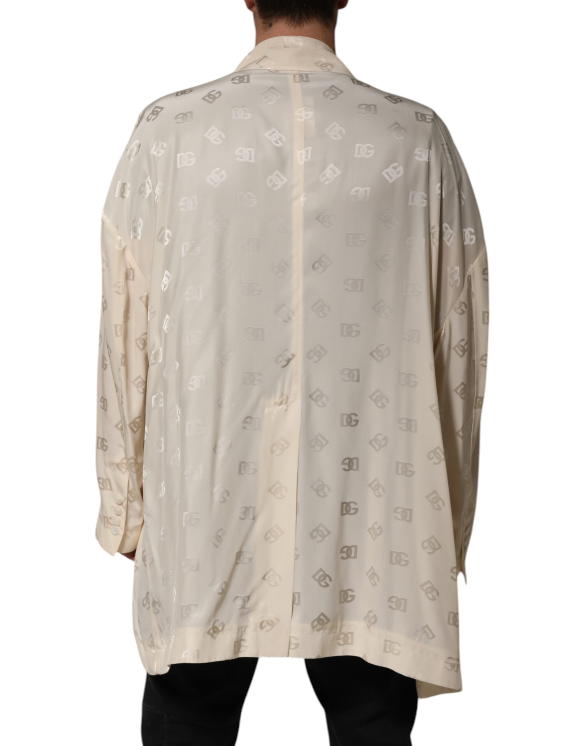 Manteau Dolce & Gabbana beige en polyester avec logo monogramme, veste élégante et slim, visible en gros plan dans l'image.