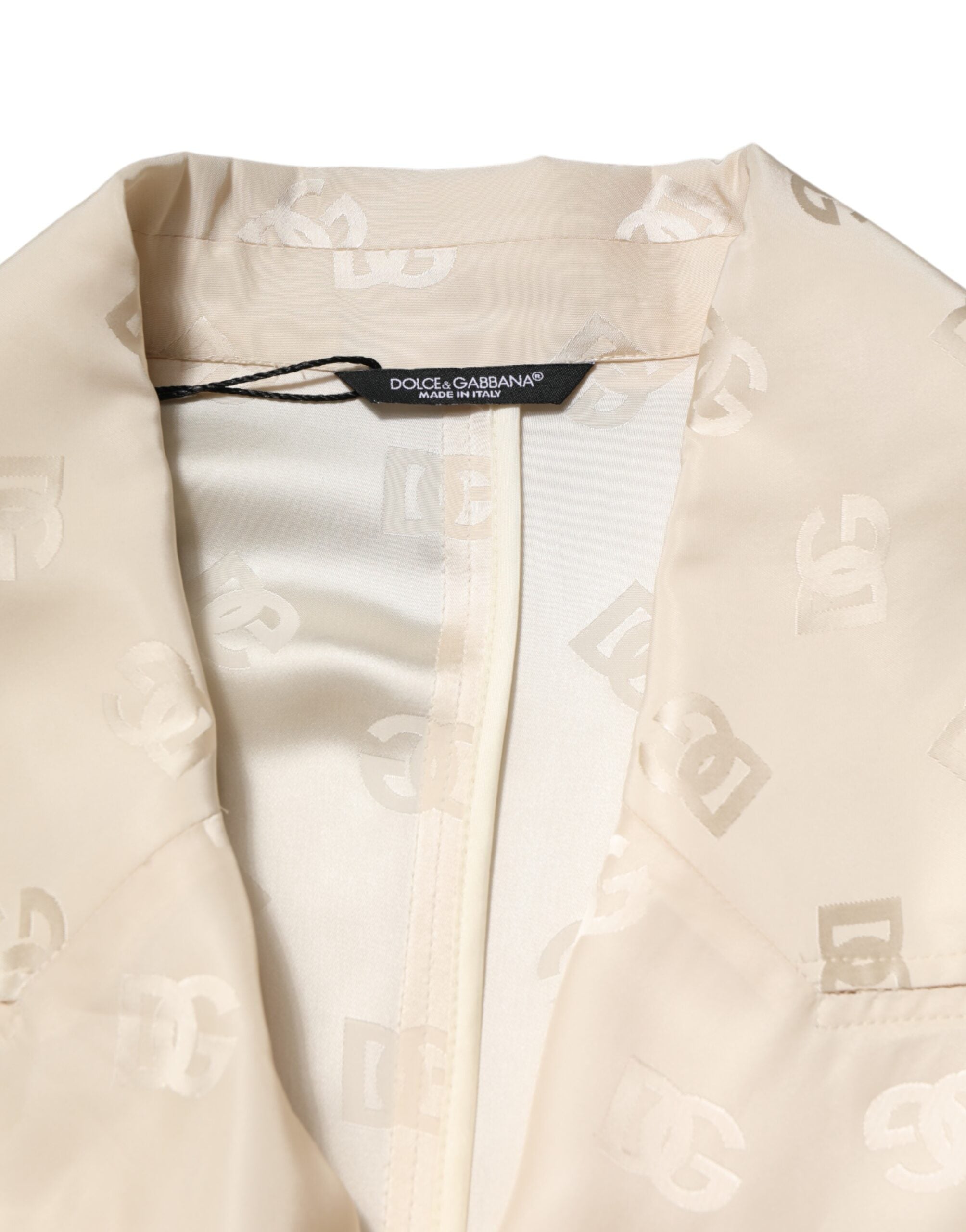 Manteau beige en polyester avec logo monogramme Dolce & Gabbana, veste élégante et sophistiquée.
