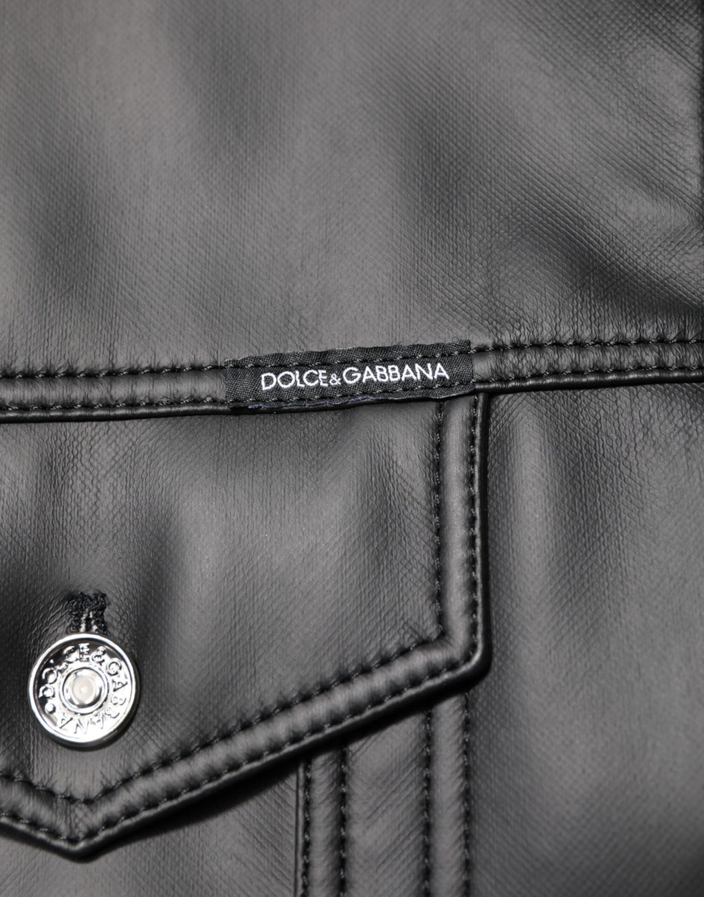 Veste motard noire en polyester Dolce & Gabbana avec boutons, style décontracté et tendance.