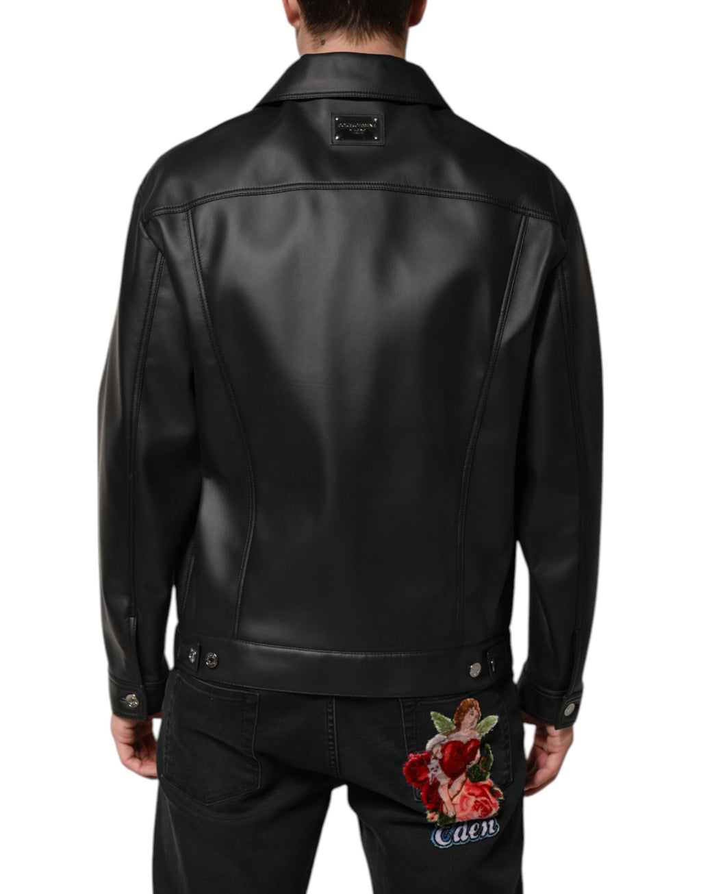 Veste biker noire en polyester Dolce & Gabbana avec boutons, style moderne et élégant, vue de face sur fond blanc.