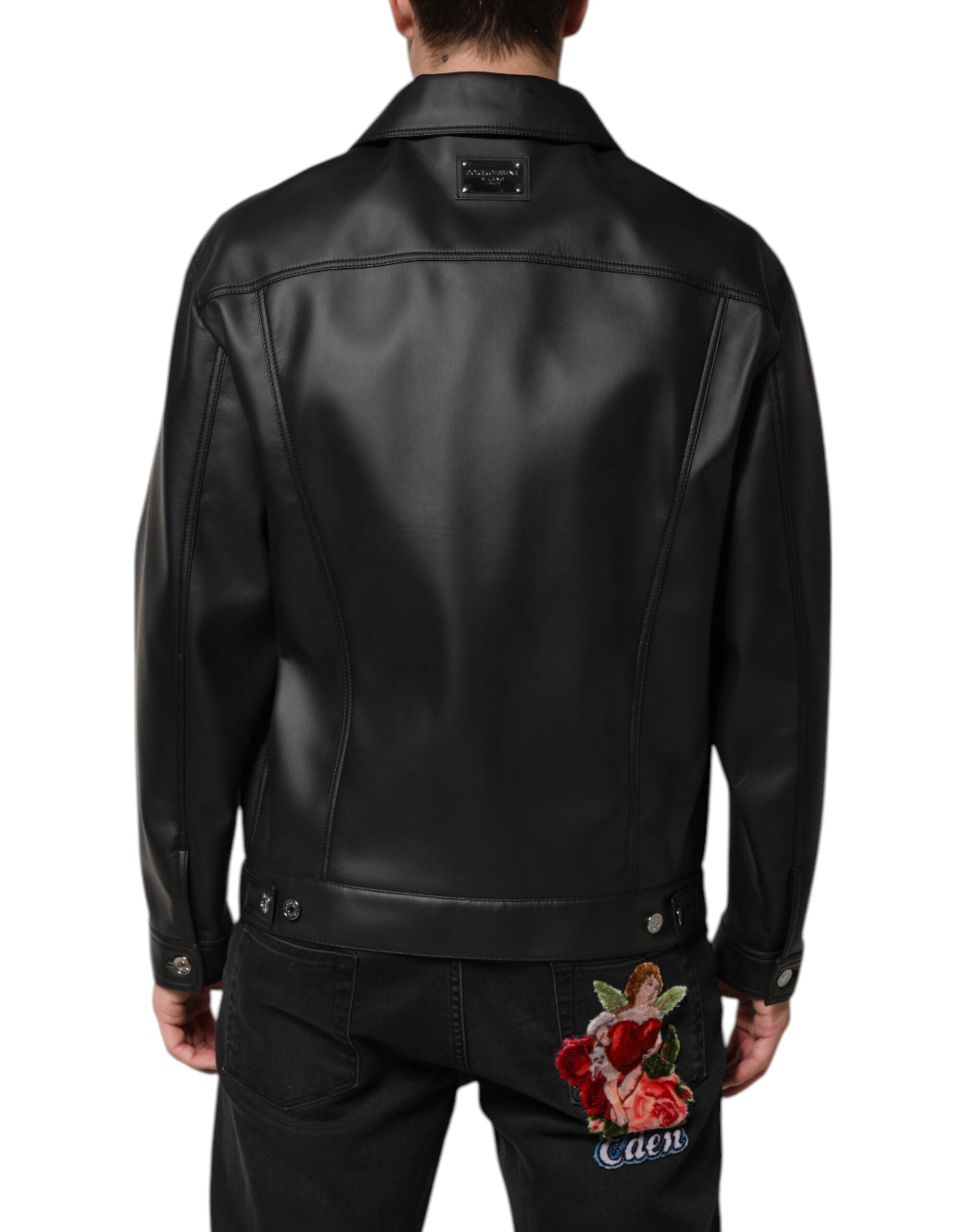 Veste biker noire en polyester Dolce & Gabbana avec boutons, style moderne et élégant, vue de face sur fond blanc.