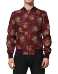 Veste bomber pour femme de Dolce & Gabbana avec imprimé plumes de paon marron et détails élégants.