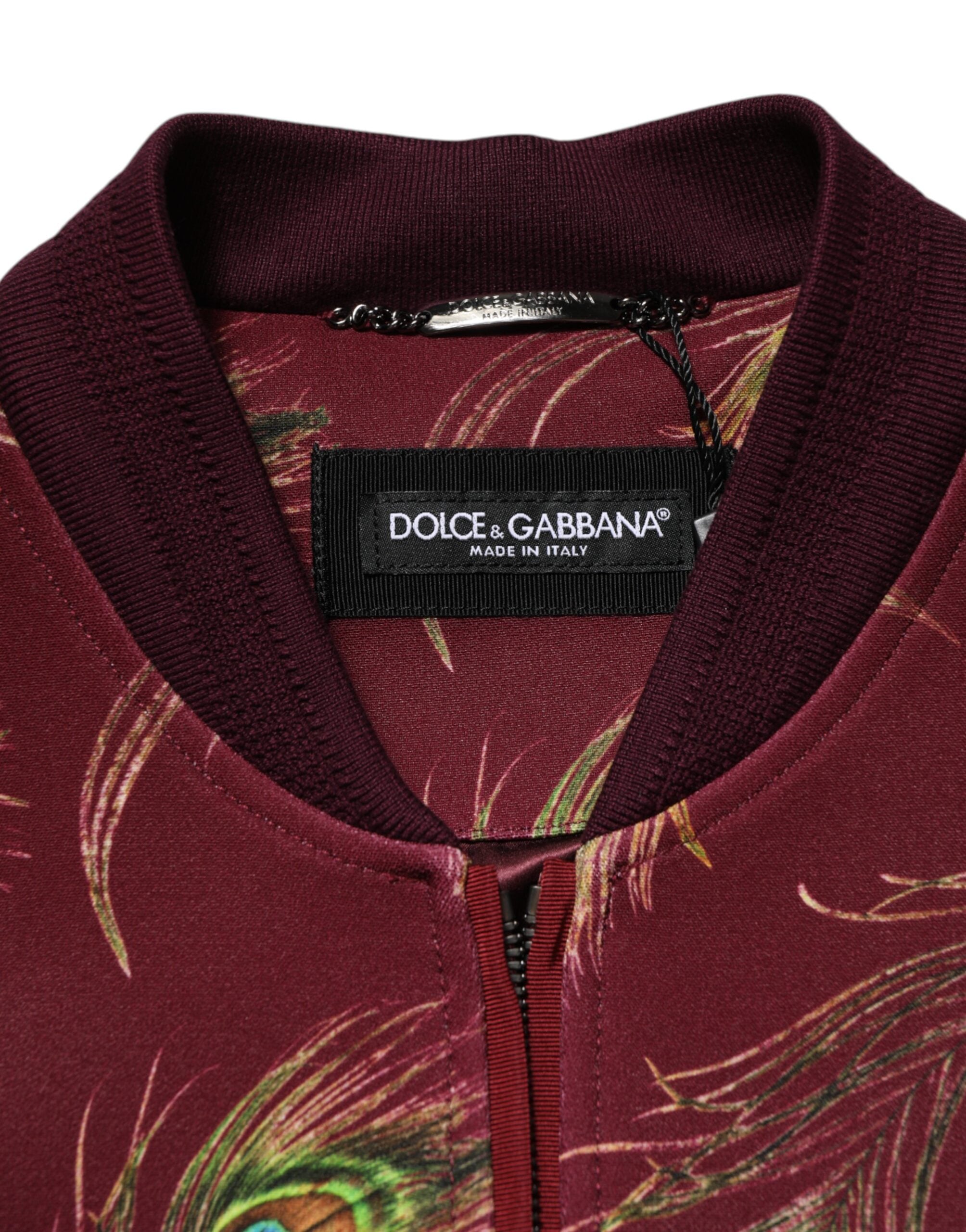 Veste bomber Dolce & Gabbana en tissu marron avec imprimé plumes de paon, style élégant et sophistiqué.