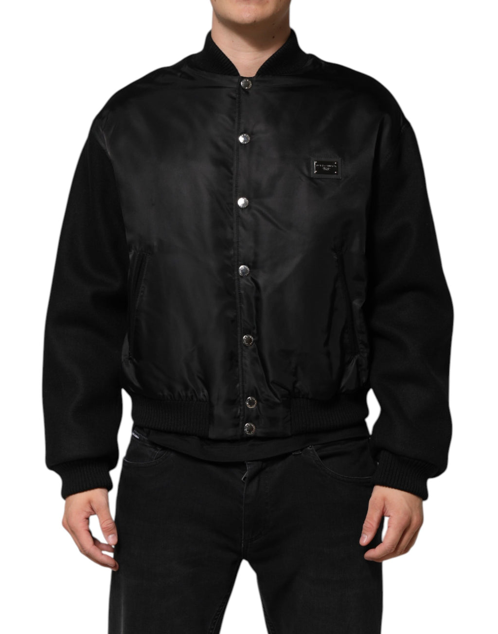 Veste bomber noire en polyester Dolce & Gabbana avec plaque de logo visible, style élégant et moderne.