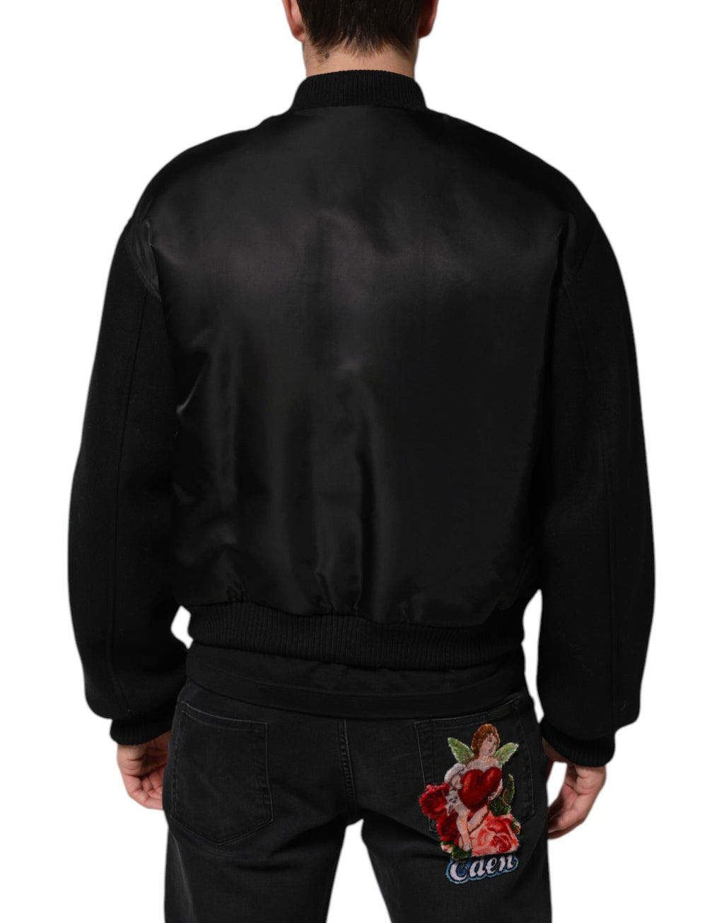 Veste bomber noire en polyester Dolce & Gabbana avec plaque logo visible sur le devant, style élégant et décontracté.