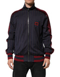 Veste zippée Dolce & Gabbana à rayures bleues et rouges avec logo en plaque sur la poitrine, style élégant et moderne.