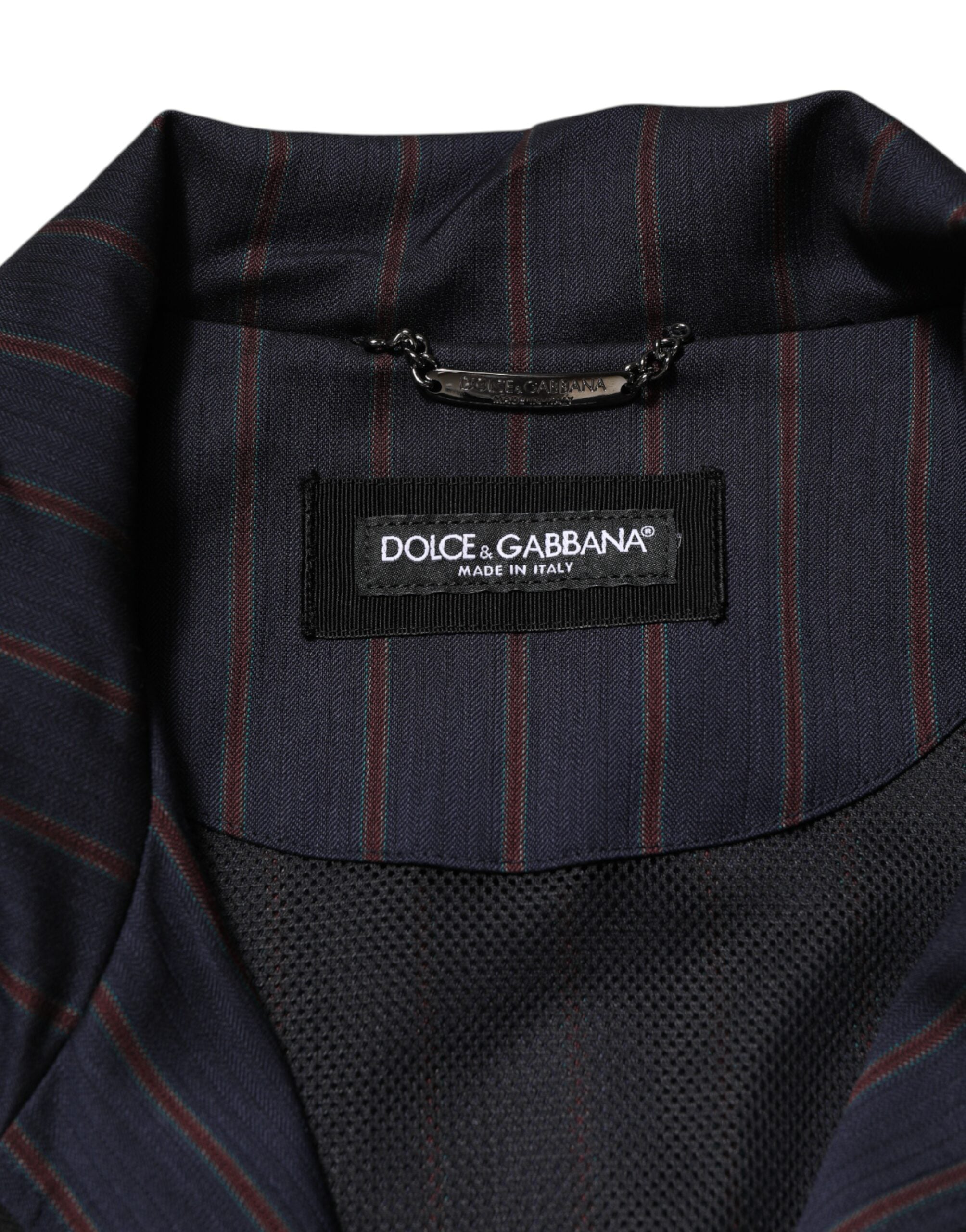 Veste zippée Dolce & Gabbana à rayures bleues et rouges avec logo en plaque, style casual et moderne.