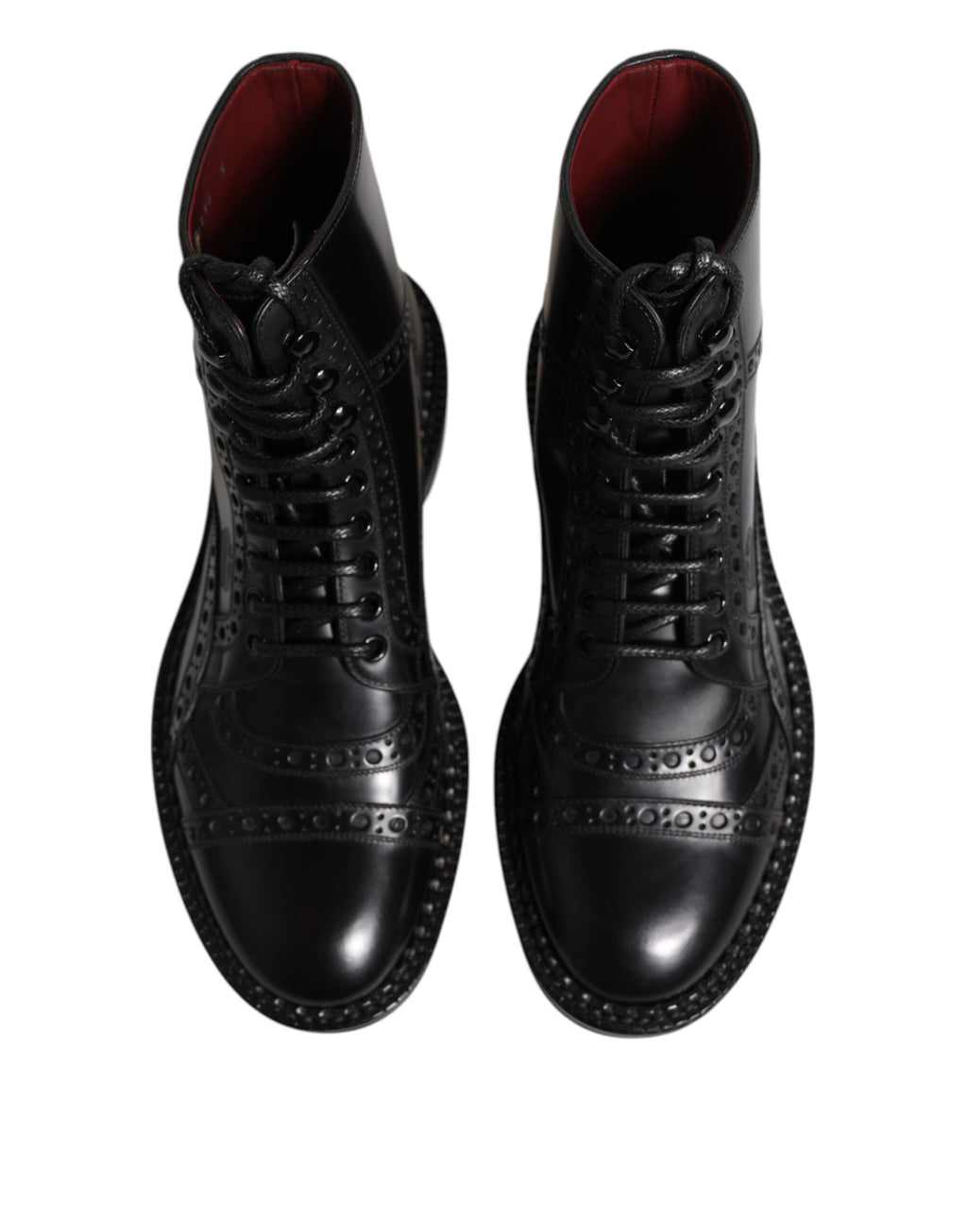 Bottes en cuir noir Dolce & Gabbana à lacets, mi-mollet, élégantes et modernes, visibles de face sur une surface claire.