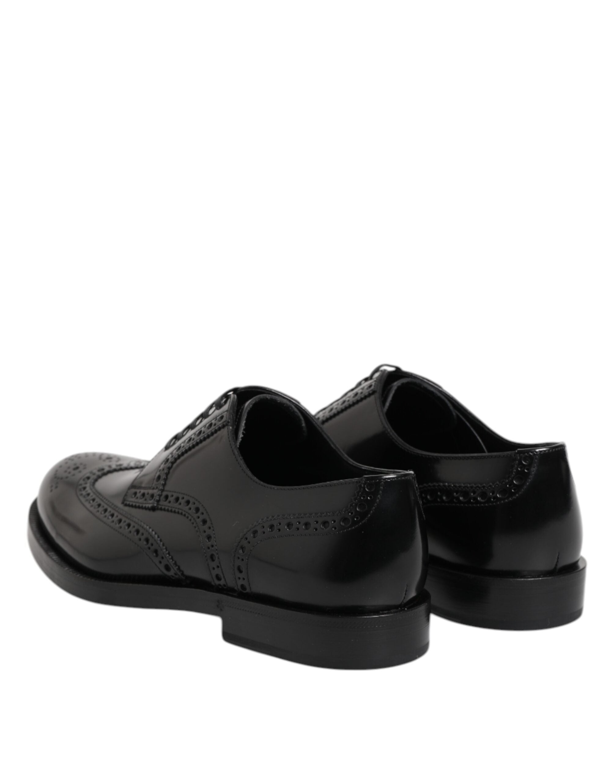 Chaussures derby noires en cuir Dolce & Gabbana, souliers formels wingtip avec détails élégants et finition de haute qualité.