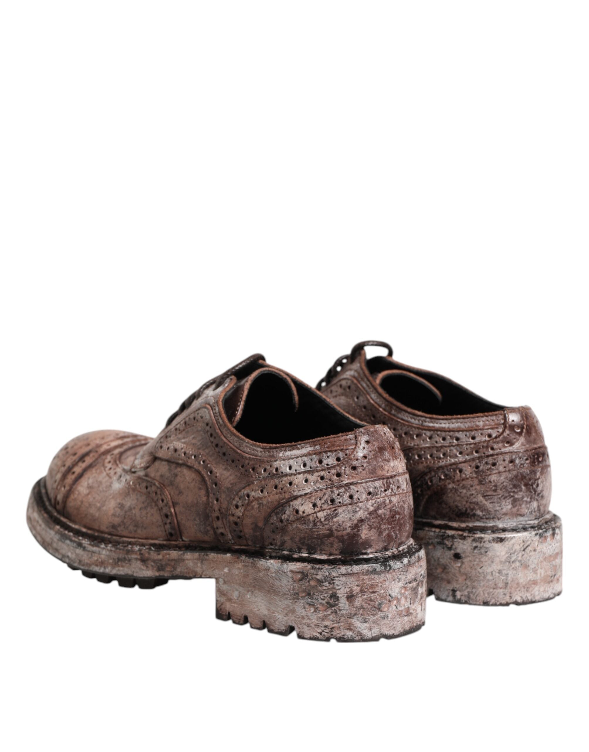 Chaussures brogues en cuir marron distressed de Dolce & Gabbana, lacets, style élégant et sophistiqué.