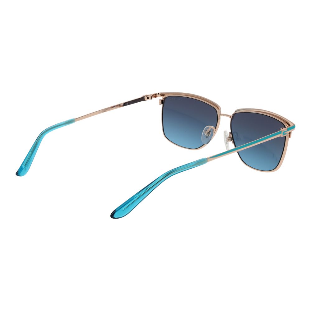 Lunettes de soleil en métal doré Guess, style tendance, avec monture fine et verres teintés pour un look élégant.