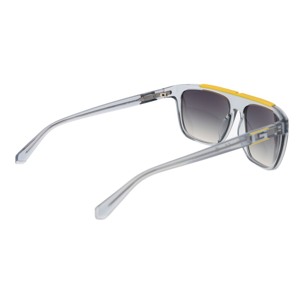 Lunettes de soleil Guess en acier inoxydable gris, style élégant avec monture rectangulaire et verres teintés.