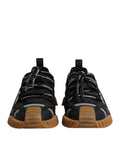 Chaussures sneakers basses noires Dolce & Gabbana avec logo en dentelle et lacets, style décontracté et élégant.