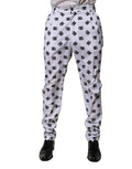 Pantalon skinny en denim blanc Dolce & Gabbana avec logo en coton, ajusté et moderne, visible dans l’image.