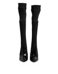 Bottes en cuir noir à côtes et talons hauts de Dolce & Gabbana, chaussures élégantes en style bottines.