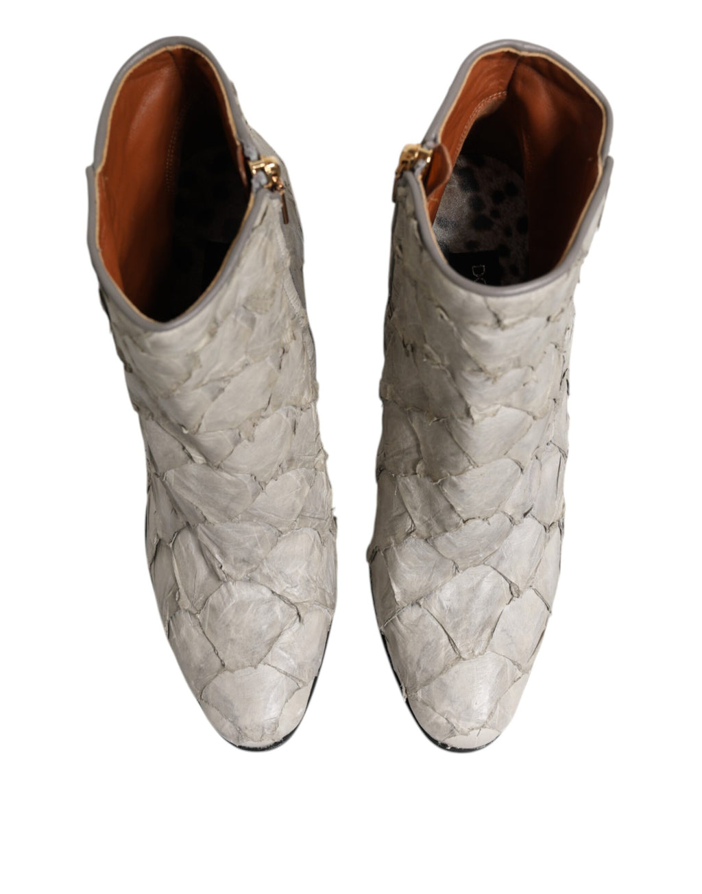 Chaussures à talons en cuir blanc Dolce & Gabbana, bottines élégantes à la cheville, avec design sophistiqué et finition soignée.